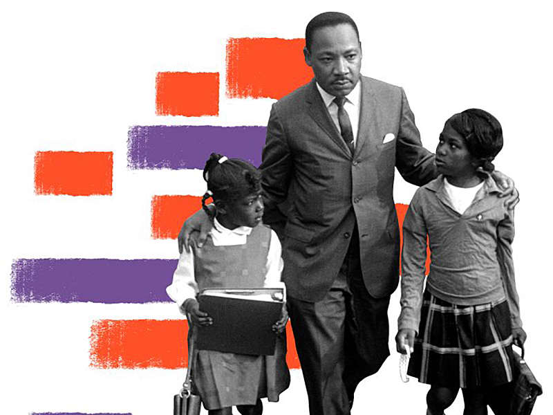 Dr. Martin Luther King Jr. walks between seven-year-old Eva Gracelemon, left, and 10-year-old Aritha Willis as he escorts black school children to formerly all-white schools in Grenada, Miss., Tuesday morning, Sept. 20, 1966.