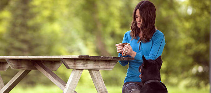 Woman picnic table dog
