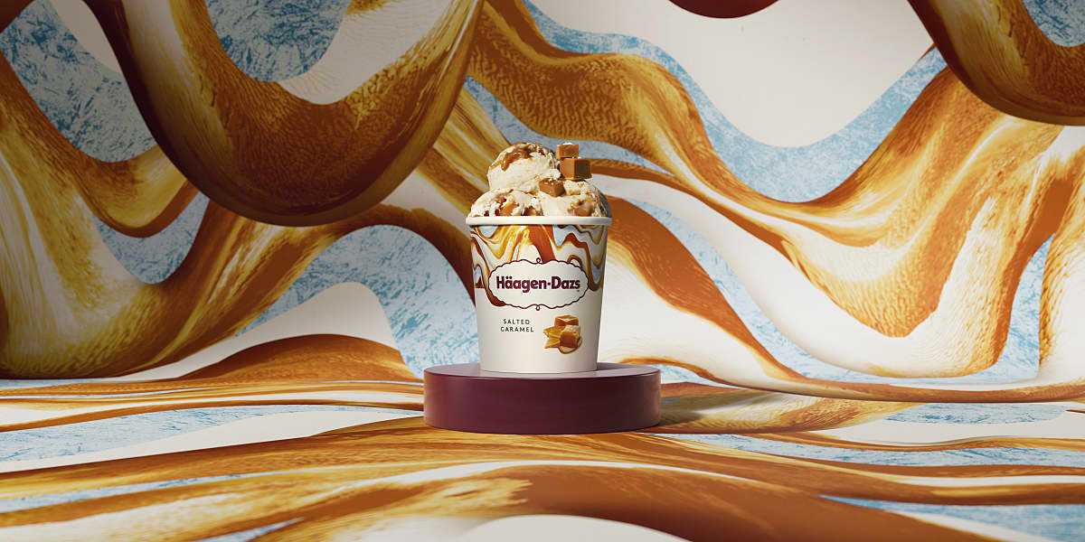 An ice cream pint with a biscuit placed on top.