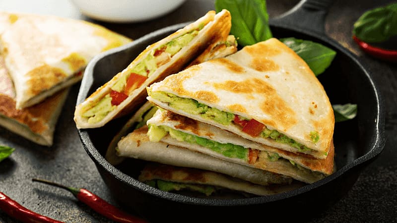 avocado quesadillas served in an black plate