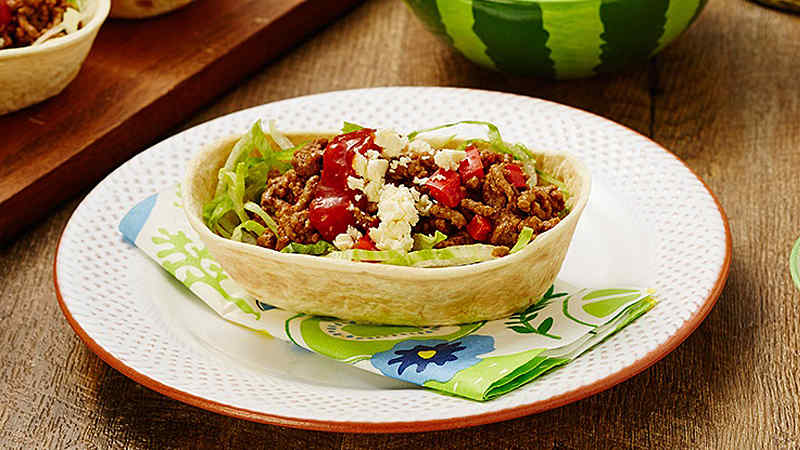 Stand ‘N Stuff™ Smoky BBQ Beef Soft Tacos with Red Capsicum served on white plate