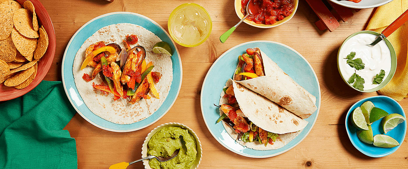 smoky BBQ fajitas served with guacamole, nachos and salsa