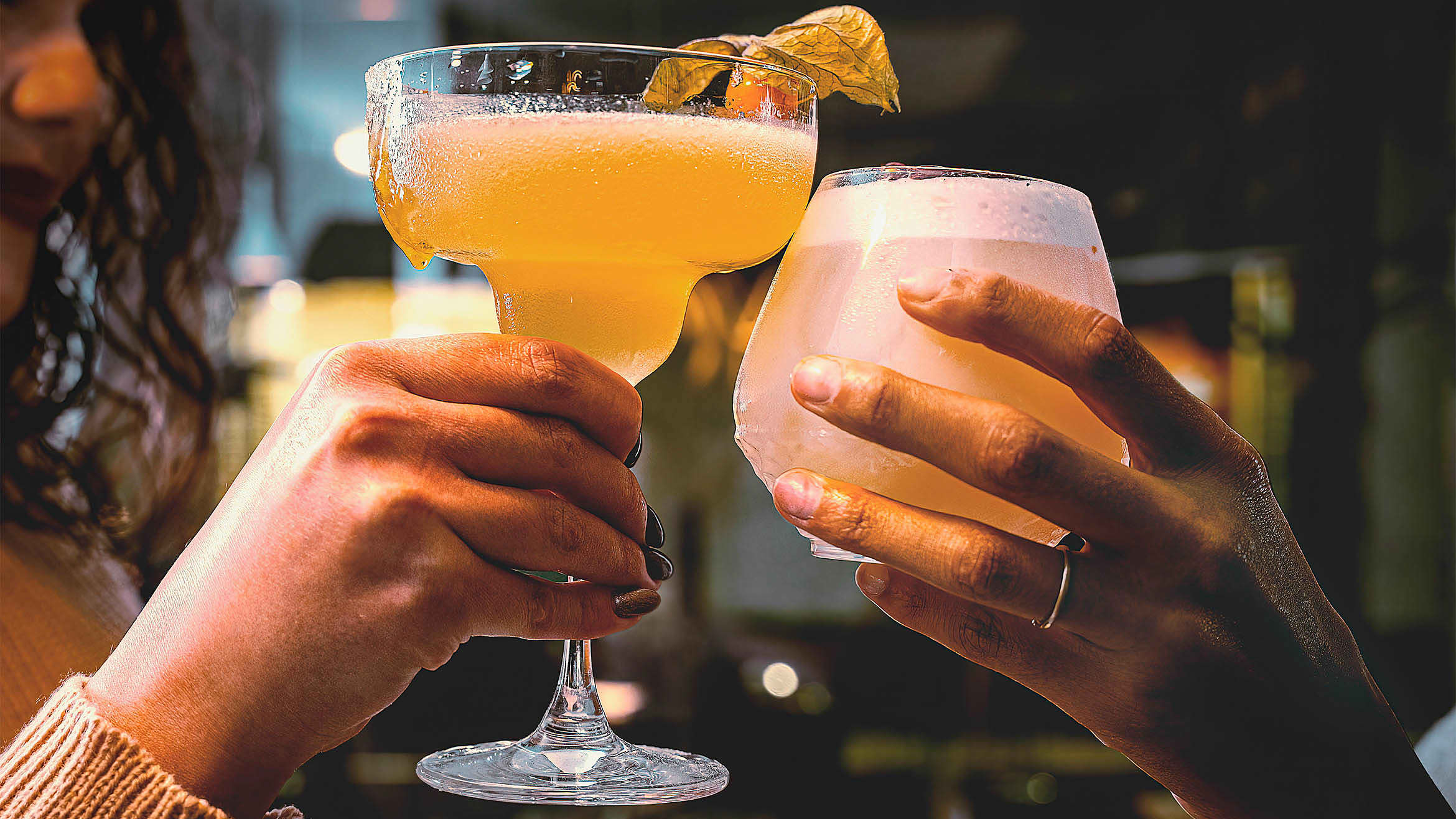 To drinks being held up in a toast