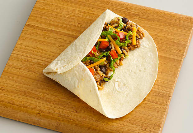 Fold the left third of the tortilla over the ingredients