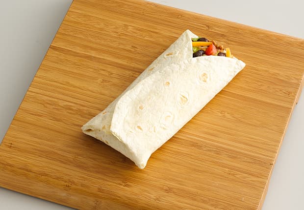 Fold the right third of the tortilla over the ingredients