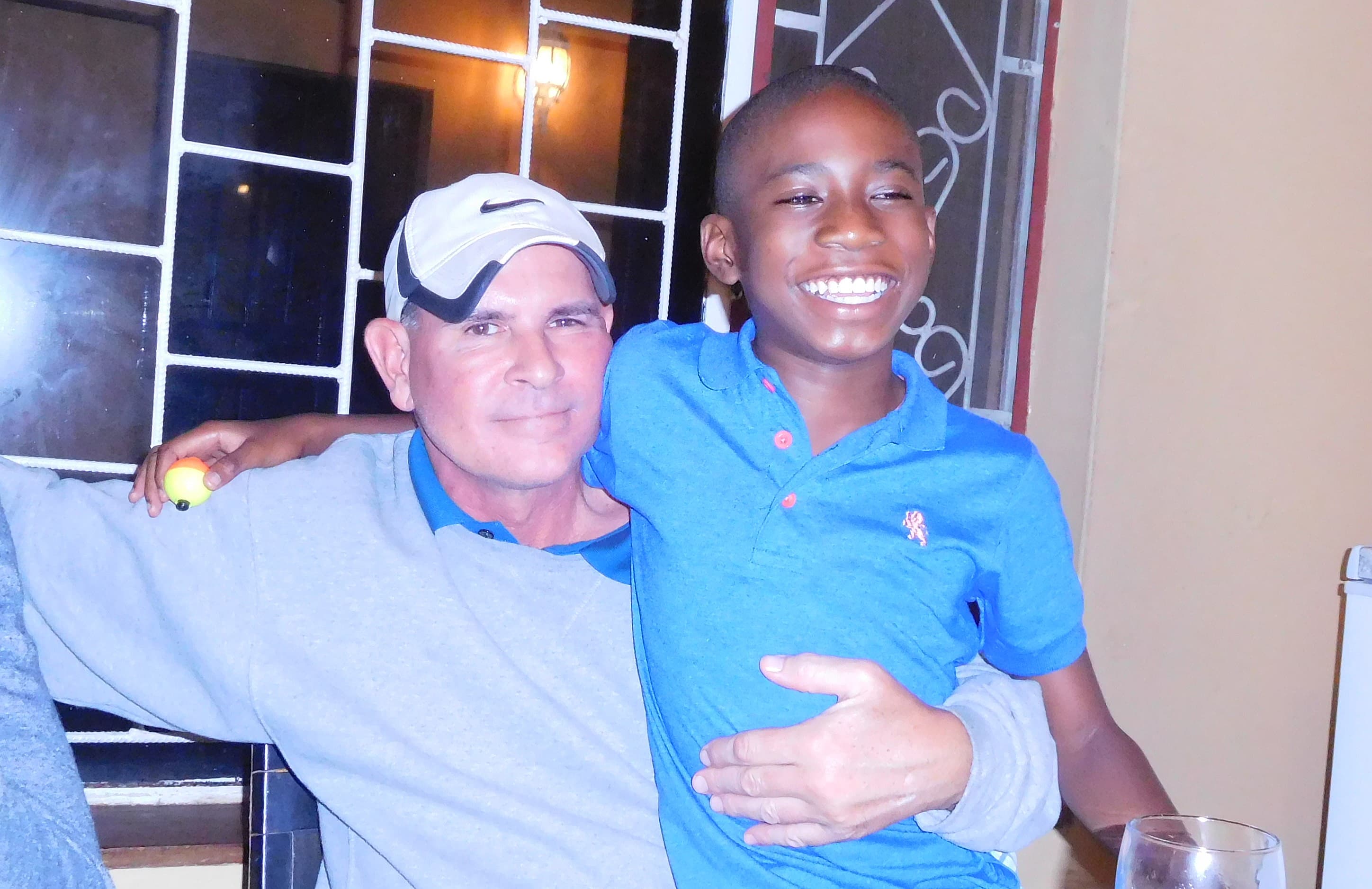 Dr. Tim Meade with adopted son Timmy