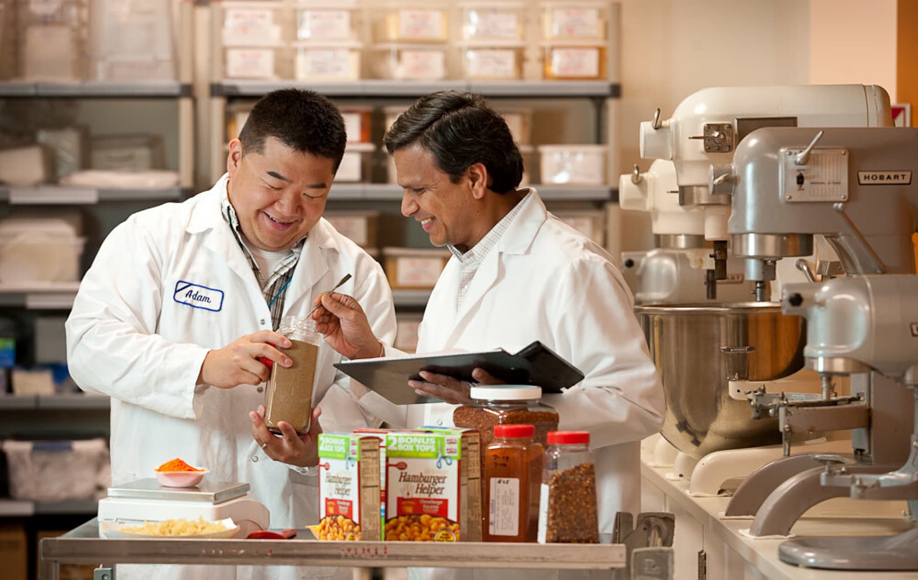 Two R&D scientists testing food