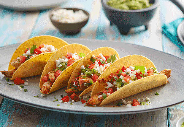 CHICKEN AND LAYERED GUACAMOLE BLUE CORN TACOS